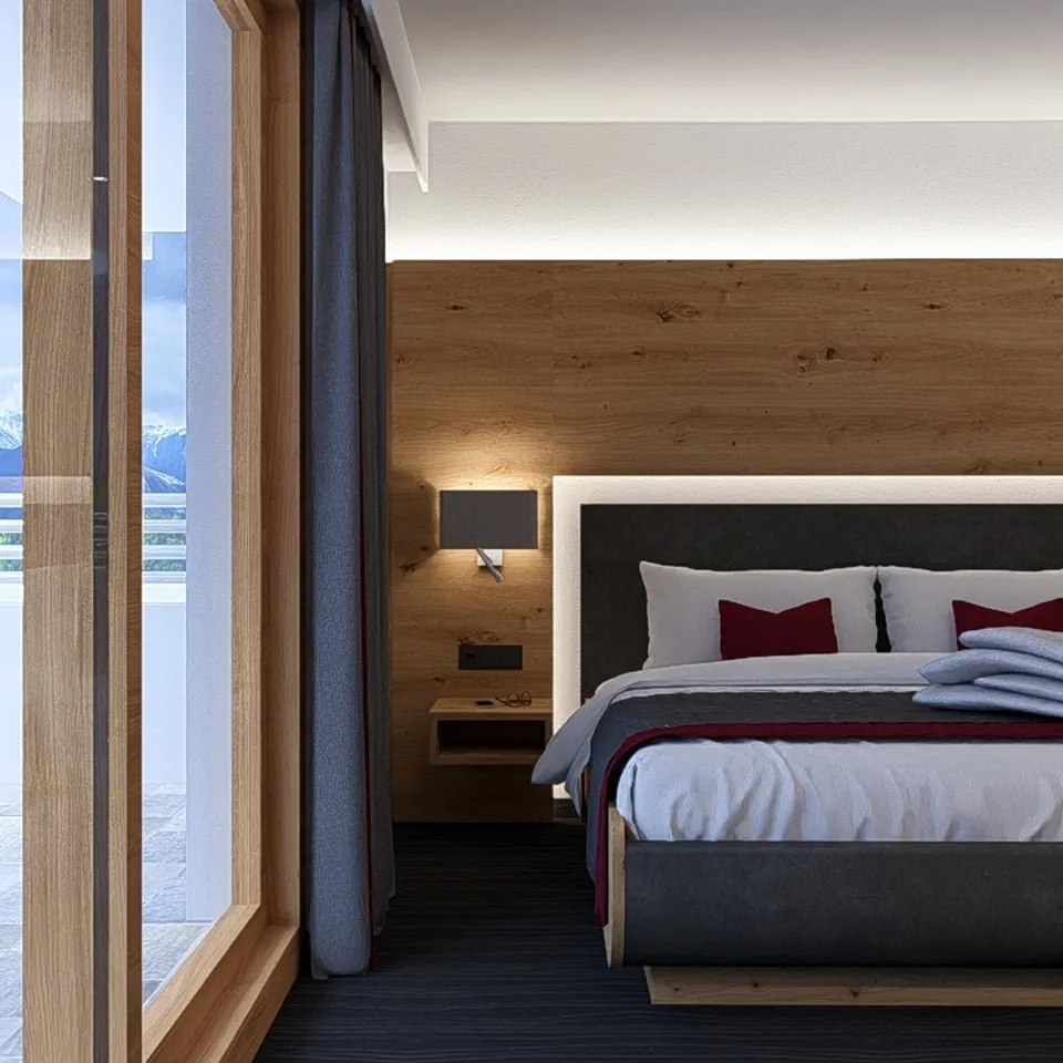 Modern hotel room with balcony and mountain view