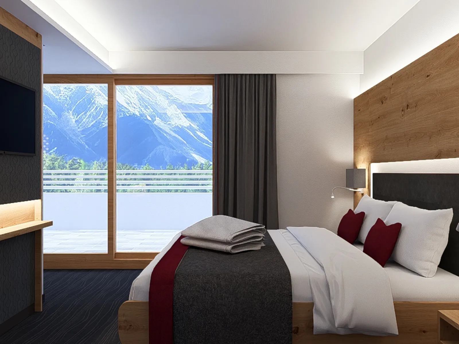 Modernes Hotelzimmer mit Bergblick durch großes Fenster